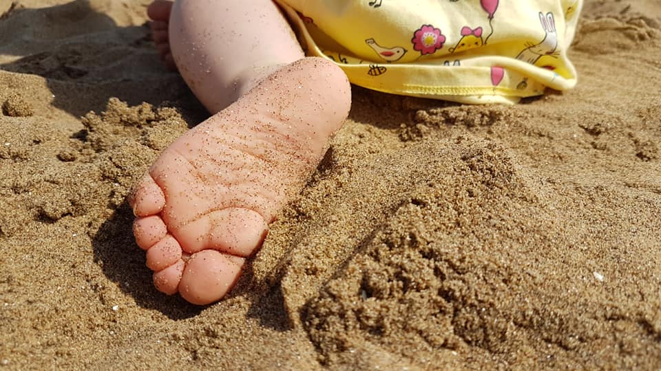 Baby foot in the sand