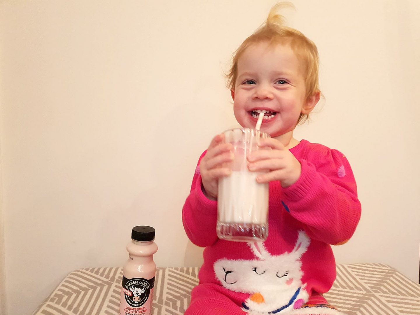 Toddler drinking Shaken Udder strawberries and Rodda's clotted cream milkshake