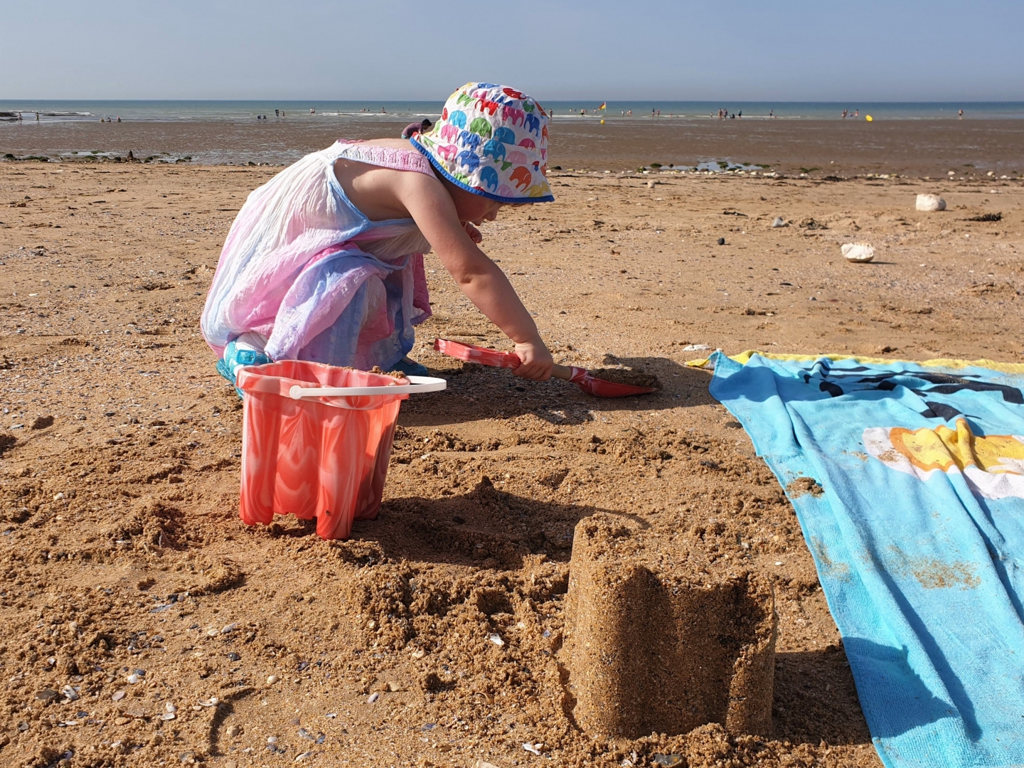 Toddler building sandcastles on Westgate-on-sea beach near Margate
