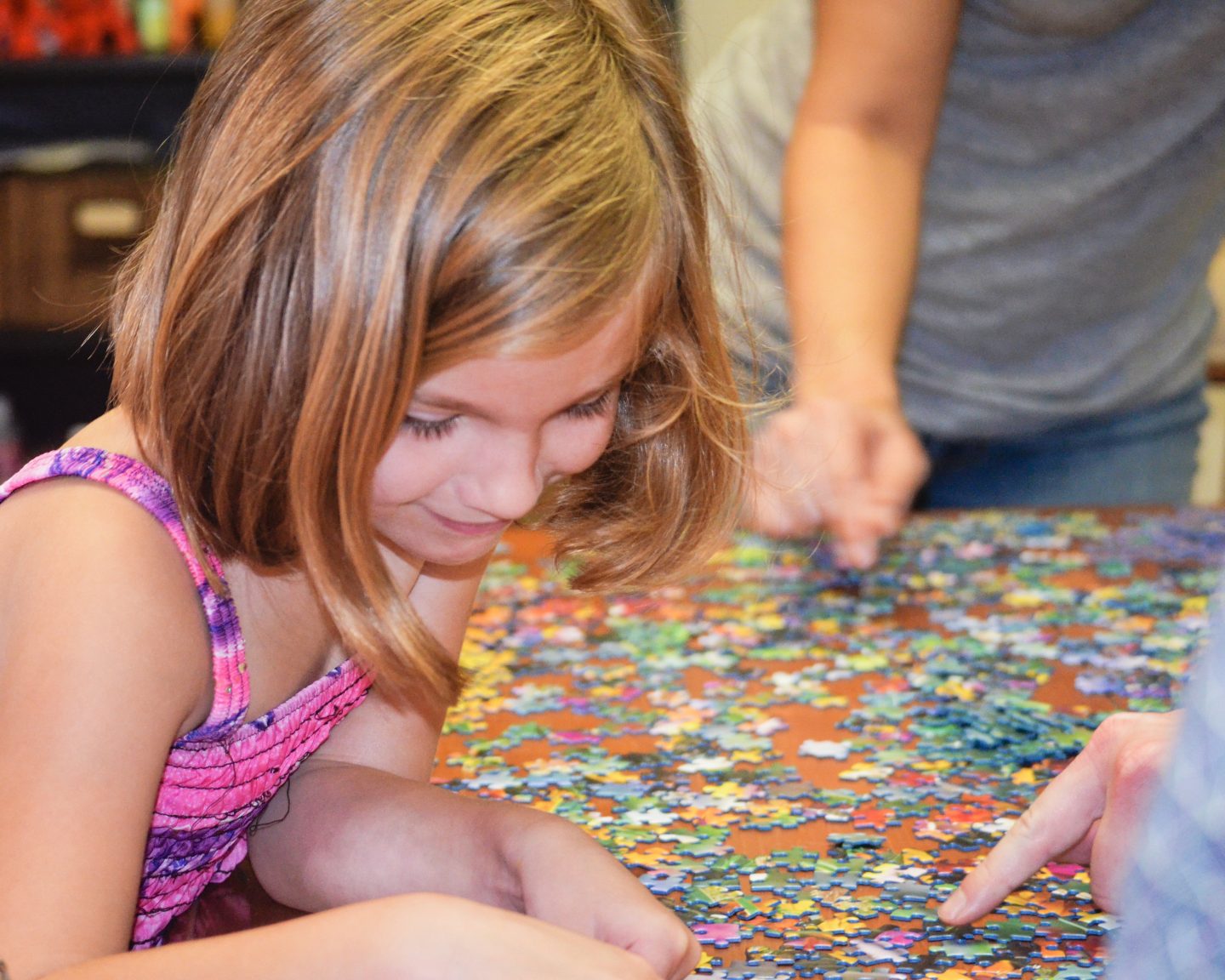 Child doing jigsaw puzzle