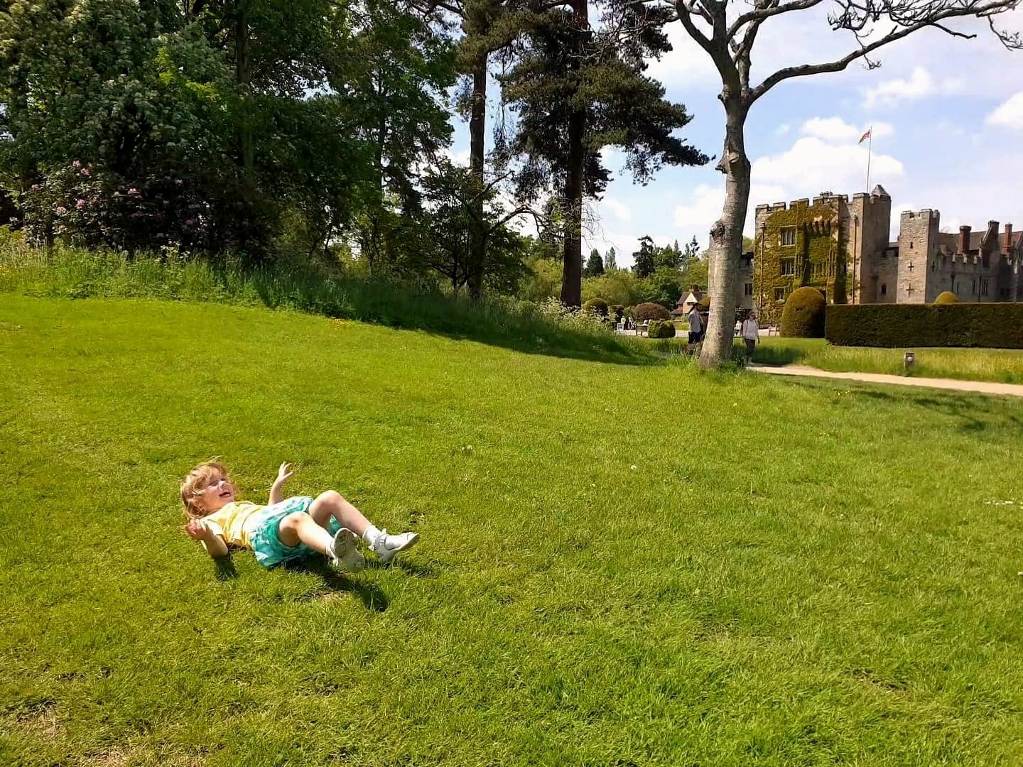 Rolling down grass hill at Hever Castle