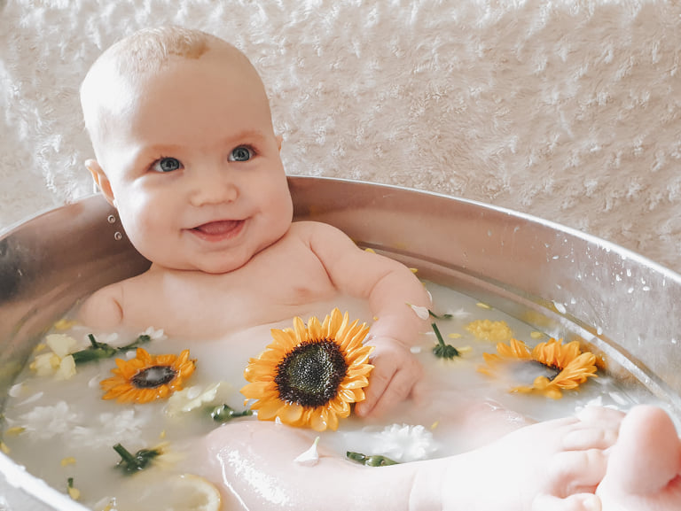 Baby boy sunflower 6 months breastfeeding milestone milk bath