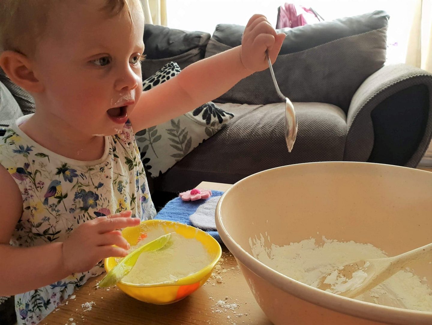 Toddler cooking with flour