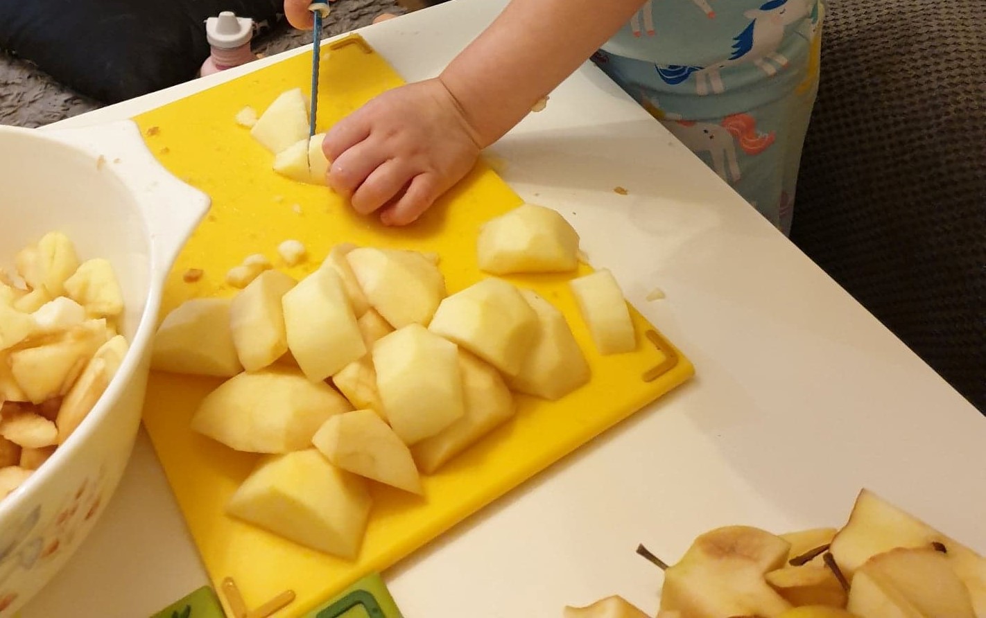 Child slicing apples